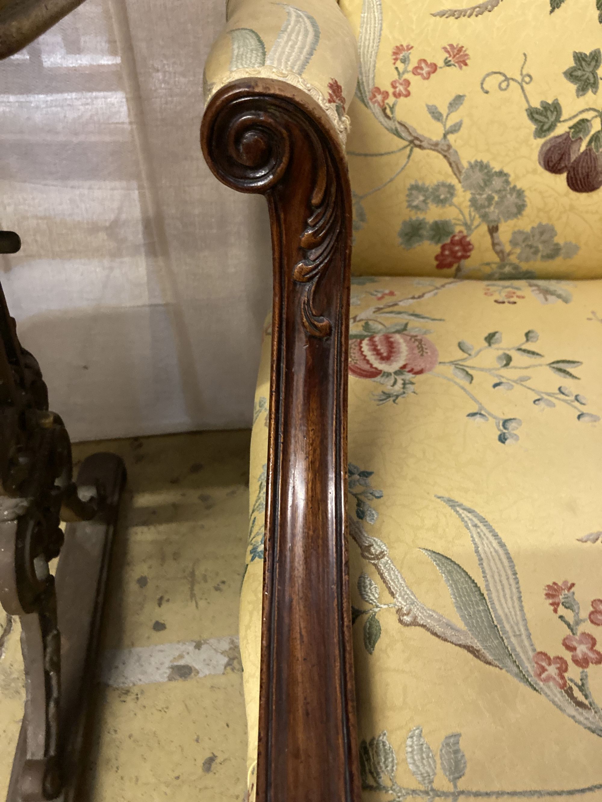 A George III style mahogany Gainsborough armchair, upholstered in a yellow ground fabric, width 68cm, depth 76cm, height 98cm